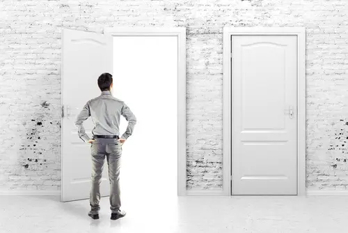 young-business-man-in-front-of-an-open-door